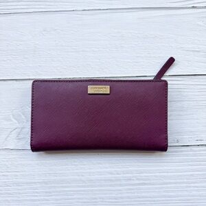 Kate Spade Laurel Way Neda Wallet in a deep plum/burgundy
